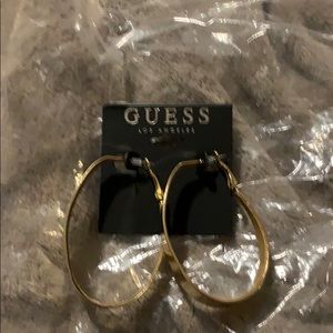 Guess earrings , new